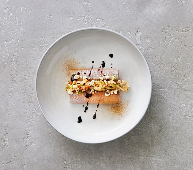 Herring with liquorice and crispy pork popcorn