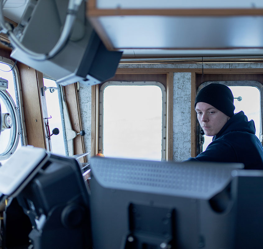 Fisherman in steeringhouse